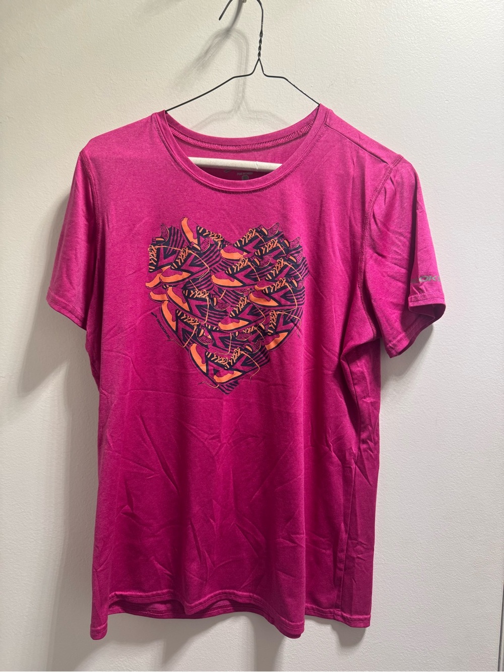 * Woman’s Pink Brooks Tee